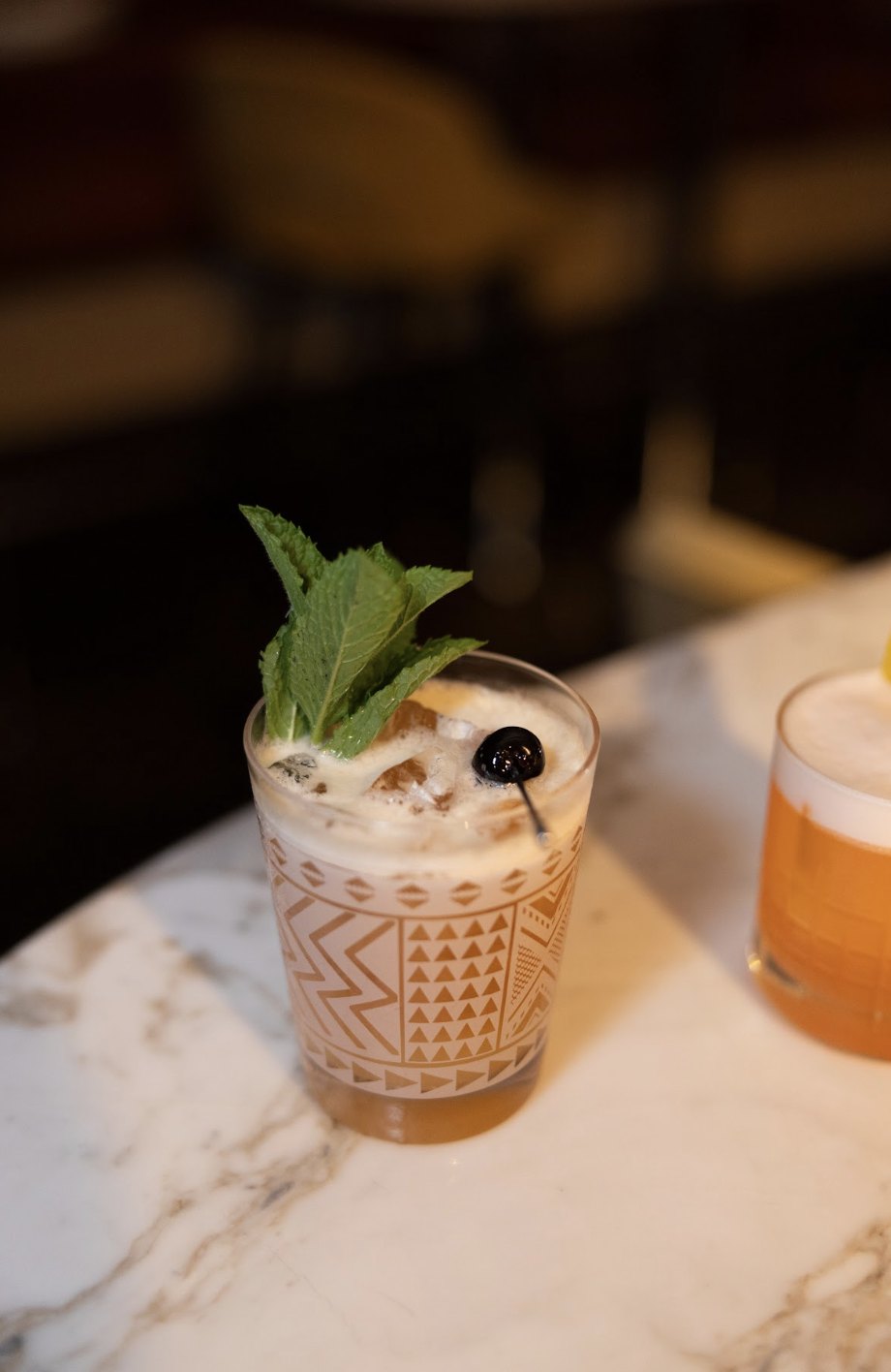 A tiki-glass cocktail with mint
