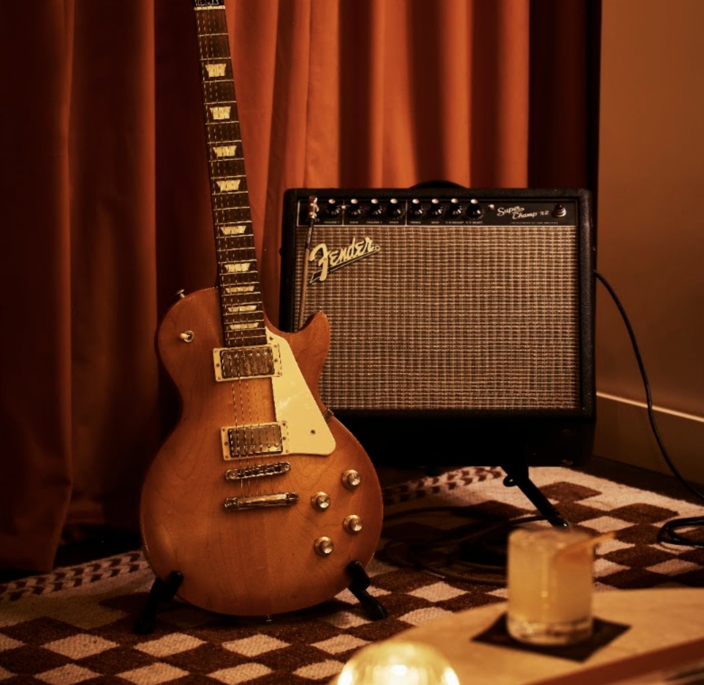 A guitar and amplifier in the Golden Sound lounge