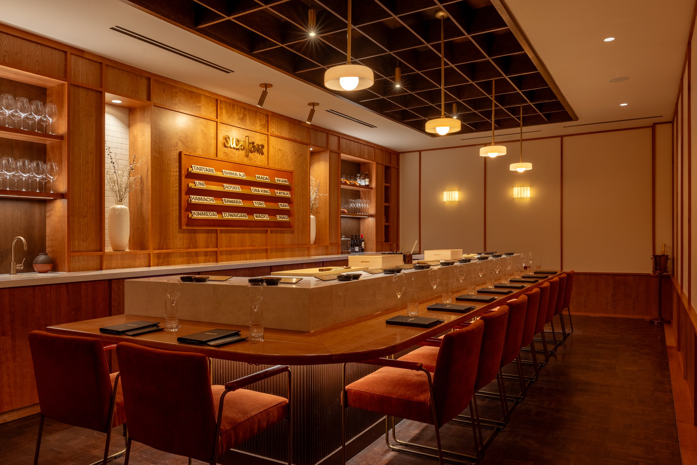 The omakase counter at Sushi | Bar Nashville, with the fish board on the wall